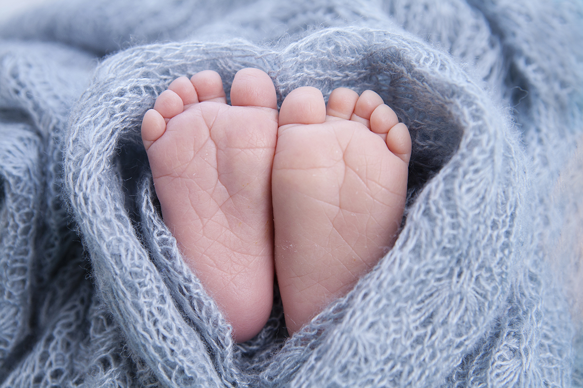 tiny foot of newborn baby
